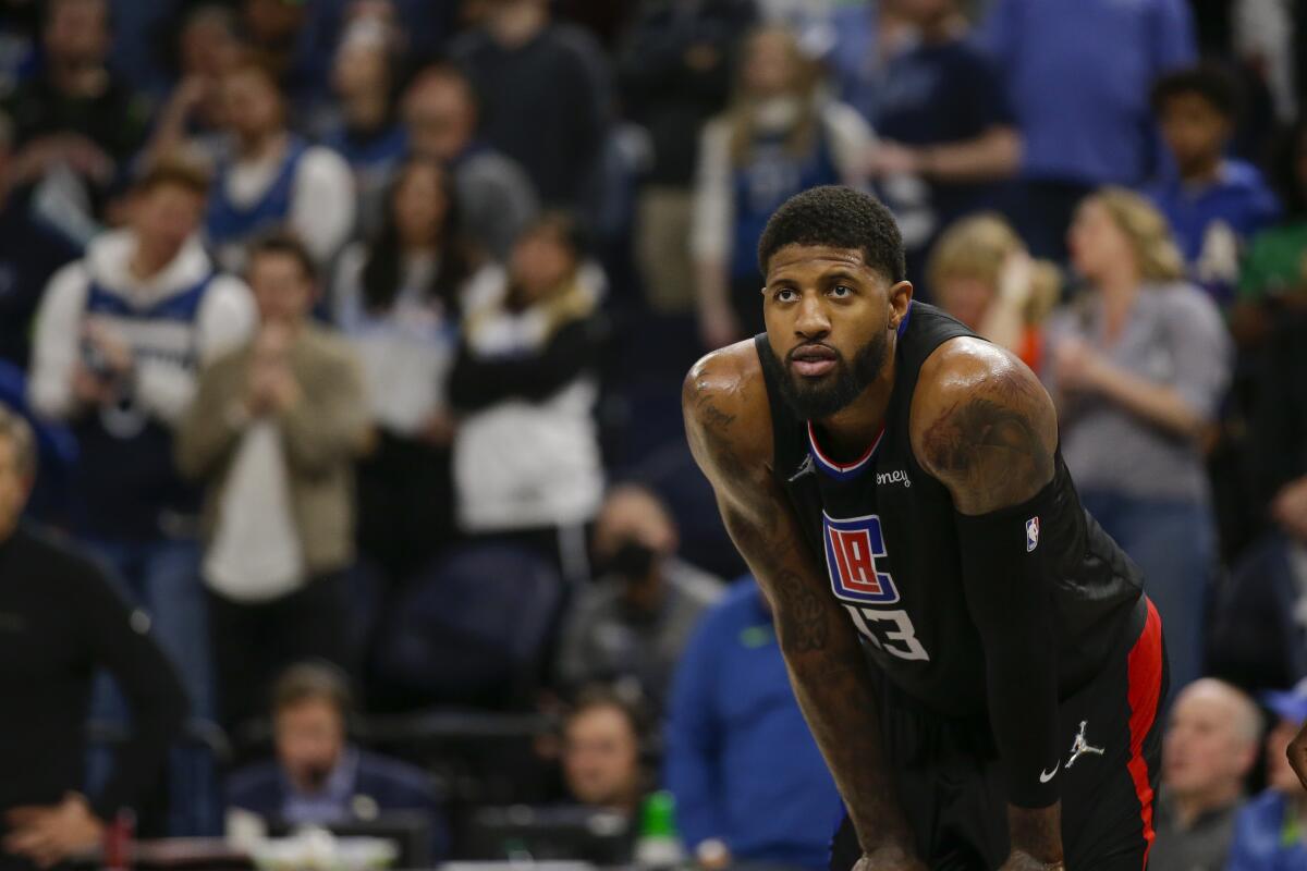 Clippers guard Paul George looks on during a game against the Minnesota Timberwolves.
