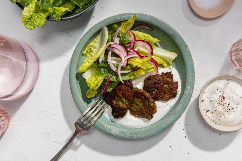 LOS ANGELES, CALIFORNIA, March 5, 2021: Crispy Chickpea Cakes with Yogurt and Romaine for the Week-of-Meals story by Ben Mims, photographed on Wednesday, June 2, 2021, at Proplink Studios in Arts District Los Angeles. (Photo and Prop Styling / Silvia Razgova, Prop Styling / Sean Bradley, Food styling / Ben Mims) ATTN: 783117-fo-june-week-of-meals