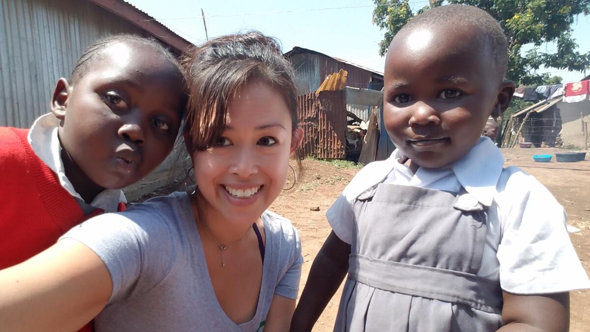 Kate Pache takes a selfie with girls in Kisumu, Kenya, where Pache's nonprofit will open a learning center in April.
