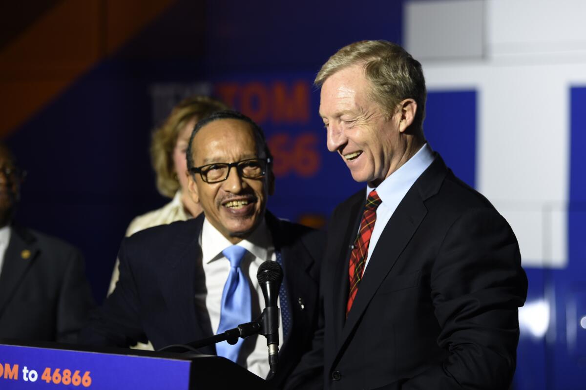Tom Steyer receives the endorsement of the chairman of the South Carolina Democratic Black Caucus, Johnnie Cordero, in Florence, S.C.