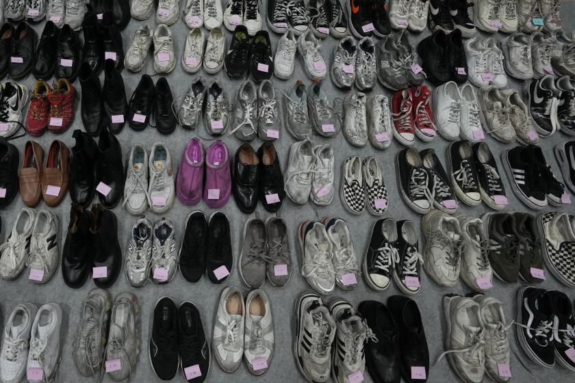 Shoes are seen among a huge collection items found in Itaewon following South Korea’s deadliest crowd surge, at a temporary lost and found center at a gym in Seoul, South Korea, Tuesday, Nov. 1, 2022. Police have assembled the crumpled tennis shoes, loafers and Chuck Taylors, part of 1.5 tons of personal objects left by victims and survivors of the tragedy, in hopes that the owners, or their friends and family, will retrieve them. (AP Photo/Lee Jin-man)