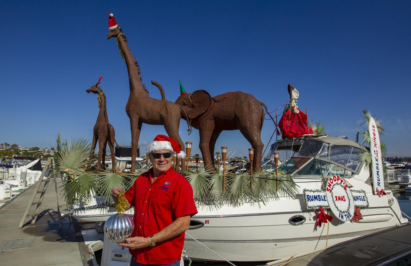 Greg Killingsworth decorates his boat "Paradise Found", a 30-foot Express Cruiser, for the Newport Beach Boat Parade. Killingsworth is an 8-time Newport Beach boat winner.