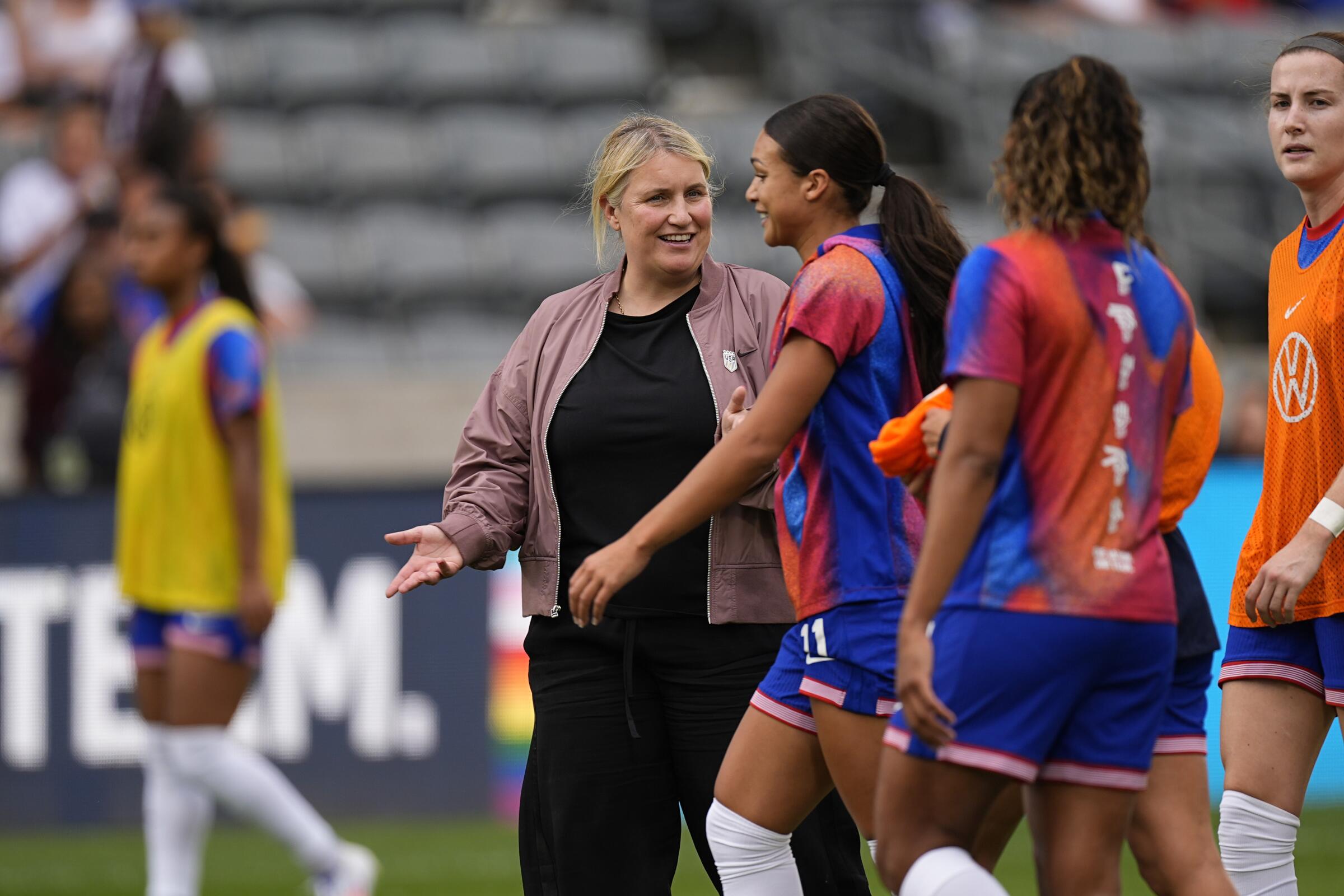 U.S. coach Emma Hayes chats with forward Sophia Smith before an international friendly win over South Korea.