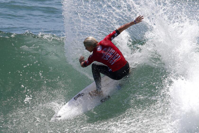 Australian Ethan Ewing, shown during a heat Wednesday, has advanced to the fifth round of the U.S. Open of Surfing.