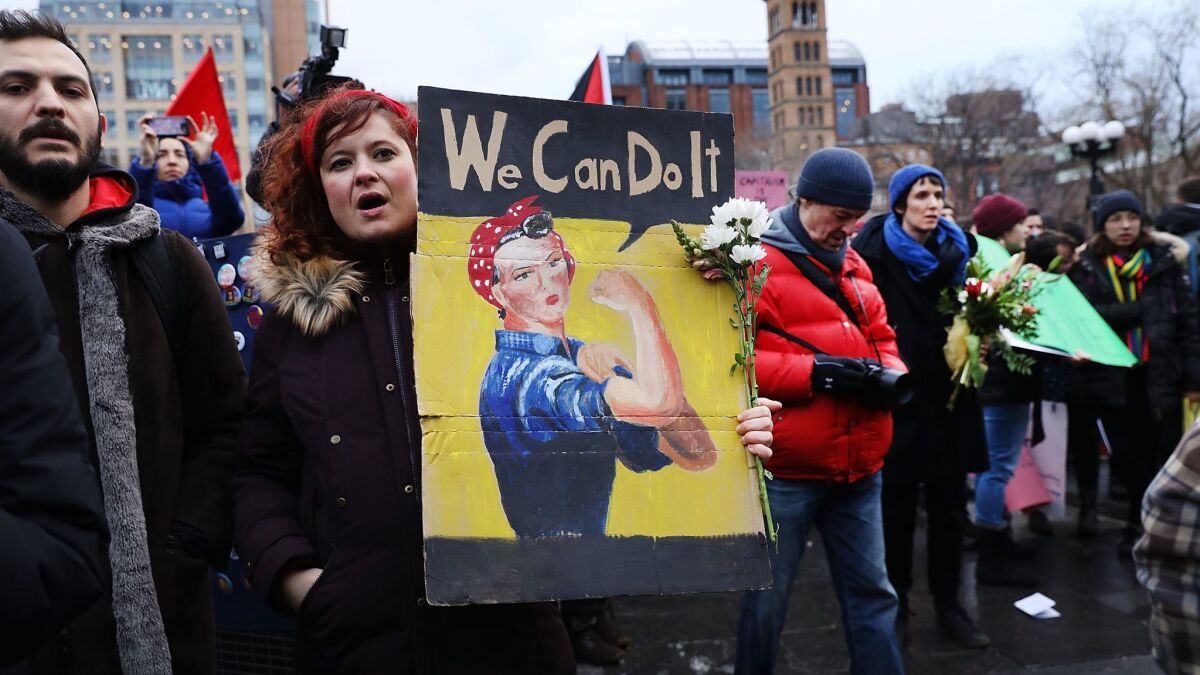 People rally and march on International Women's Day on March 8 in New York City.