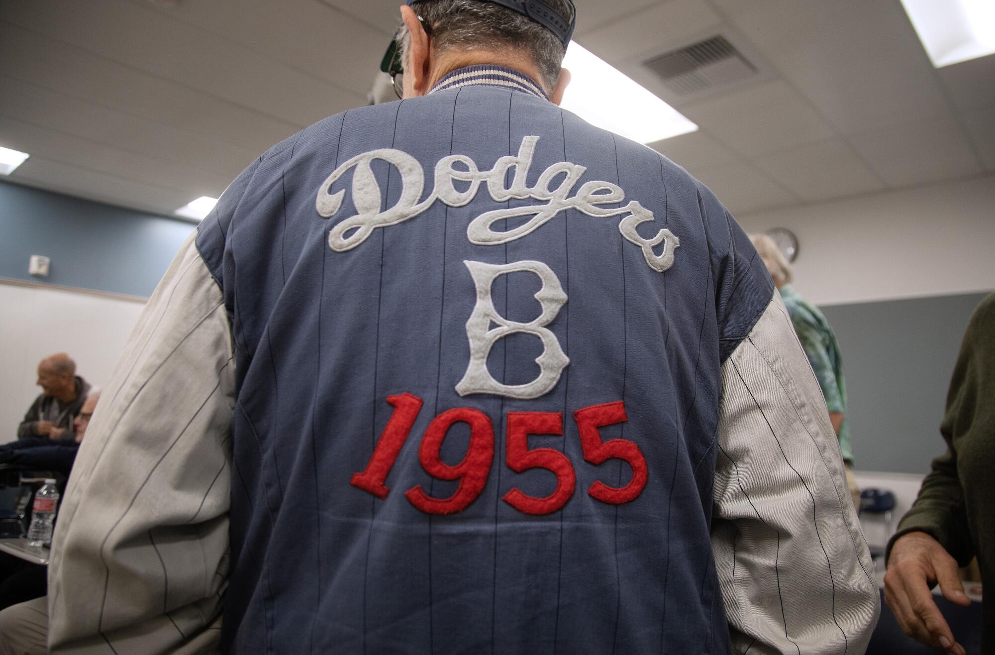 A current events sports class member proudly wears his Dodgers jacket.