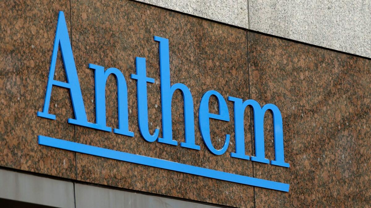 The Anthem logo at the company's corporate headquarters in Indianapolis. Anthem cut two planned premium increases after California regulators challenged its estimates of drug expenses.