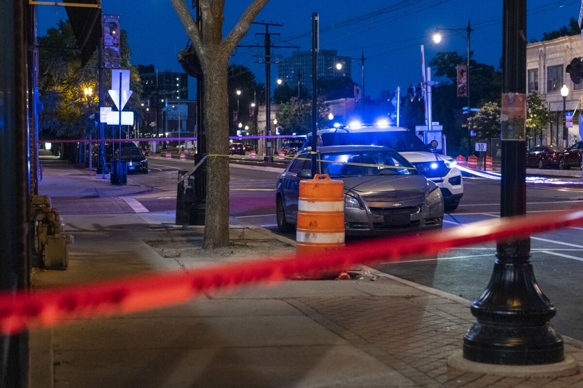 Police tape stretches across a sidewalk at the scene in Chicago where a 5-month-old girl was shot and killed Friday.