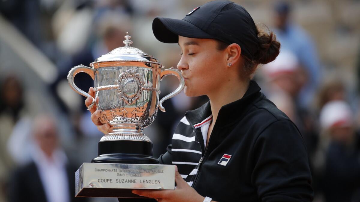 Australia's Ash Barty kisses the trophy as she celebrates her victory in the French Open women's singles championship on Saturday.