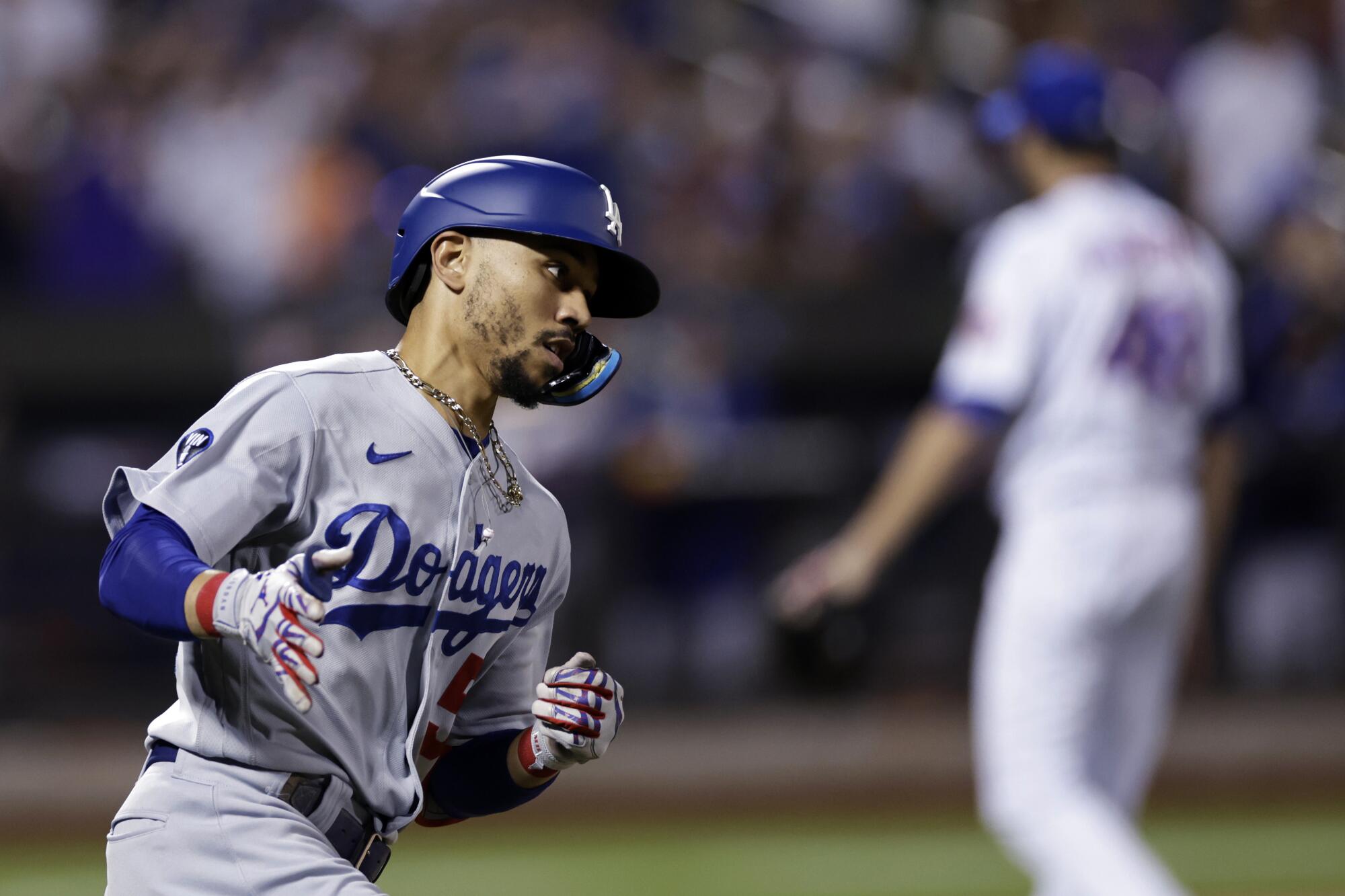 Mookie Betts hit a home run, but the Dodgers lost to the Mets on Wednesday. (AP Photo/Adam Hunger)
