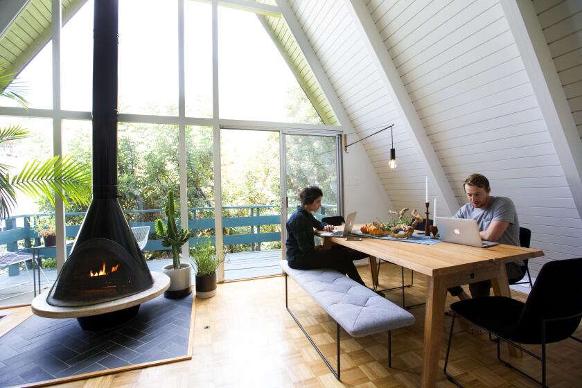 MT. WASHINGTON, CA.,SEPTEMBER 20, 2017--Jake Hurwitz, 32 and his fiance Jillian Vogel, 27. The couple moved into the 1965 A-Frame in Mt. Washington last year and worked with designer Jennifer Wallenstein to update the interiors. (kirk McKoy /Los Angels Times)