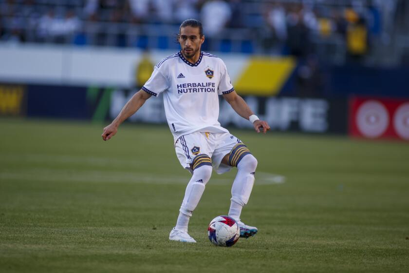 LA Galaxy defender Martín Cáceres (22) controls the ball against the Seattle Sounders during the second half of an MLS soccer match in Carson, Calif., Saturday, April1, 2023. (AP Photo/Ringo H.W. Chiu)