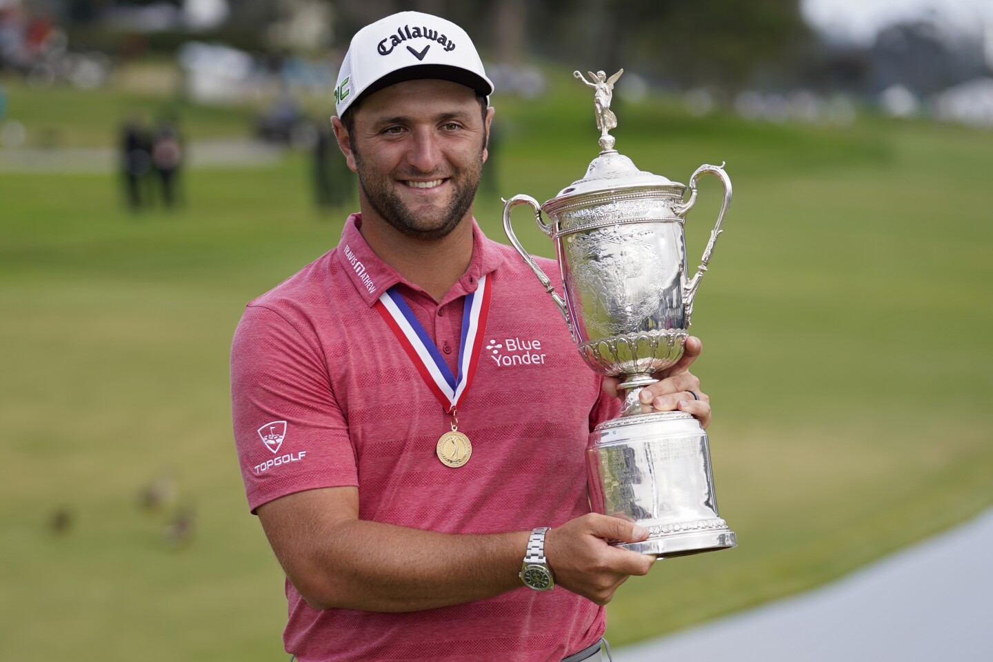 Jon Rahm, of Spain, holds the champions trophy for photographers after the final round of the U.S. Open Golf Championship, Sunday, June 20, 2021, at Torrey Pines Golf Course in San Diego. (AP Photo/Marcio Jose Sanchez)