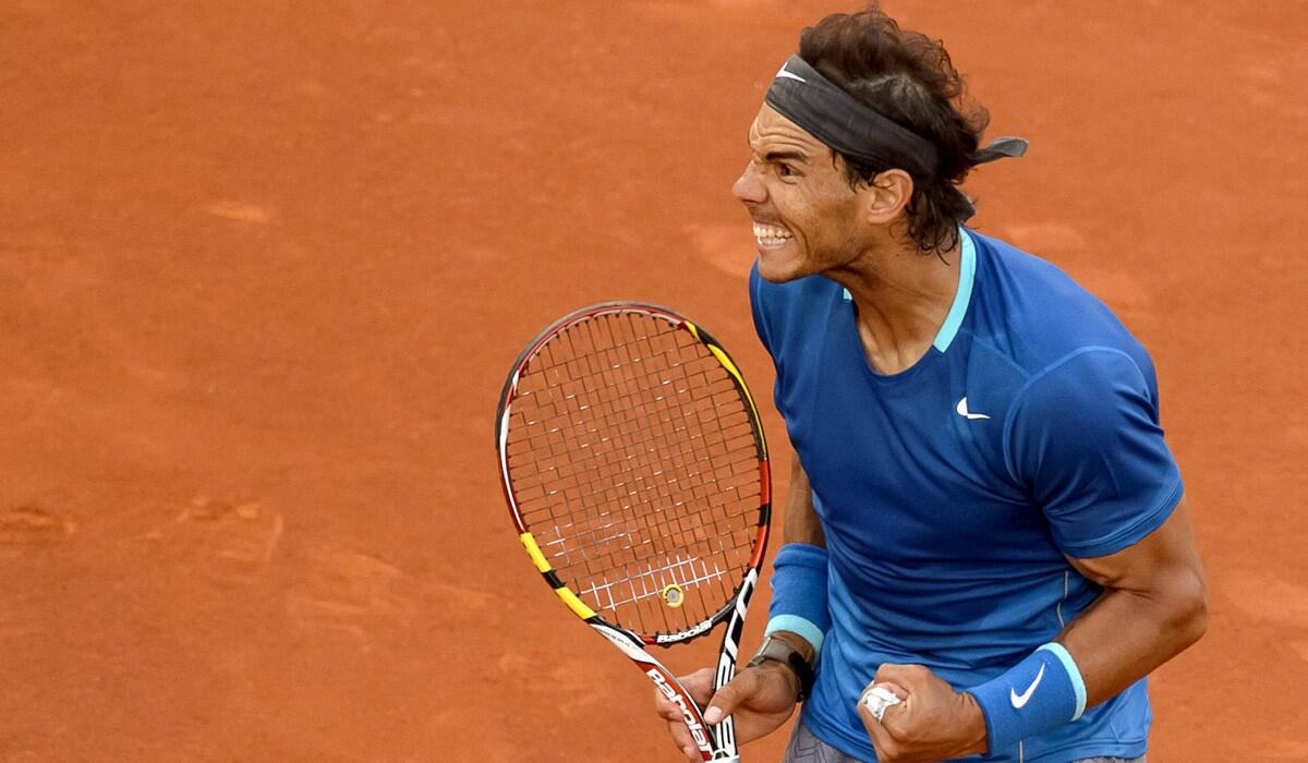 Rafael Nadal celebrates after winning a point against Kei Nishikori in the championship match at the Madrid Open on Sunday.