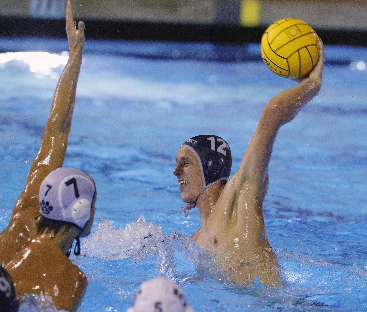 Newport Harbor's Tommy Kennedy shoots and scores against Loyola in the second half of the CIF Southern Section Division 1 semifinal playoff match at Woollett Aquatics Center in Irvine on Wednesday.