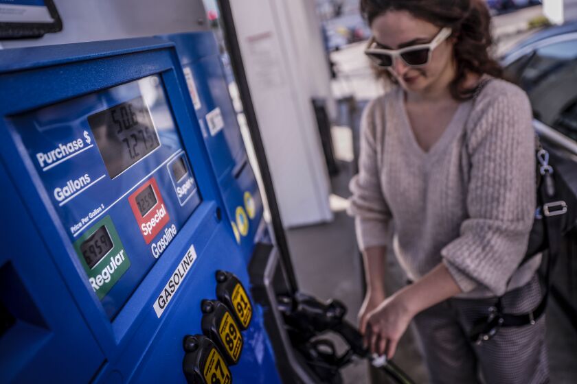 West Hollywood, CA, Tuesday, March 8, 2022 - Jasmine pumps 7.275 gallons of regular gas at 6.95 a gallon for a total of 50.63 dollars at a Mobil station at the corner of La Cienega and Beverly. (Robert Gauthier/Los Angeles Times)