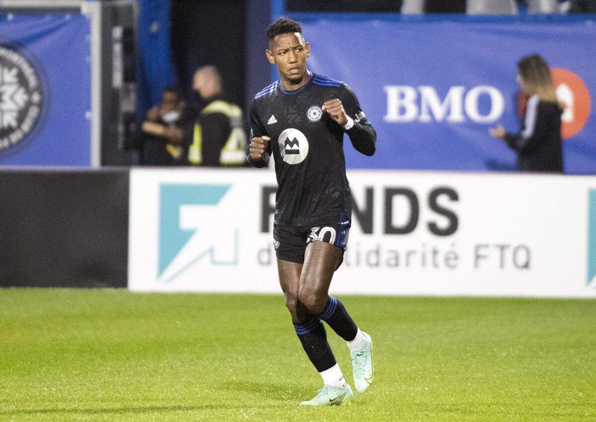 CF Montreal's Romell Quioto (30) gives a fist pump to his bench after scoring against Atlanta United during the second half of an MLS soccer game in Montreal, Saturday, Oct. 2, 2021. (Graham Hughes/The Canadian Press via AP)