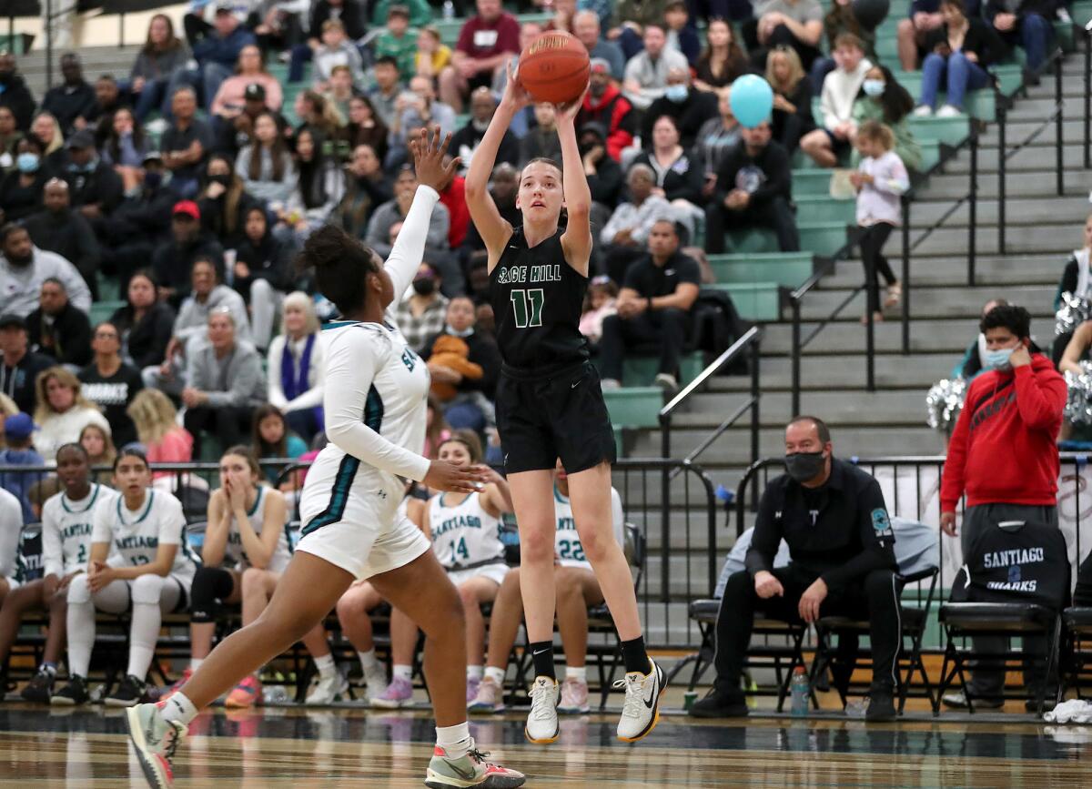 Sage Hill's Kat Righeimer (11) hits a long two-point basket against Corona Santiago on Tuesday.
