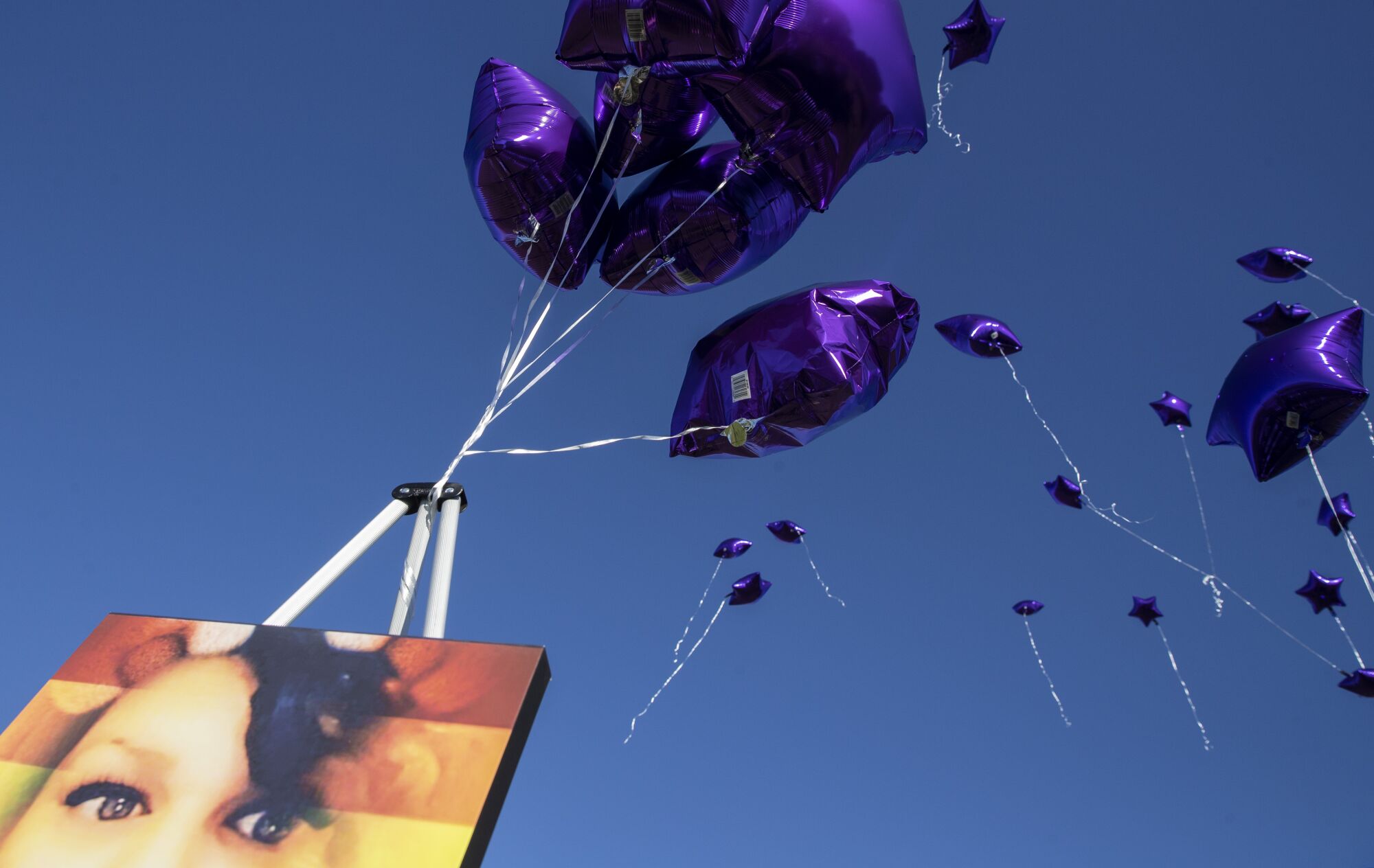 Balloons float away in honor of Tatyana Cantu Broughton at Desert Memorial Park in Cathedral City.