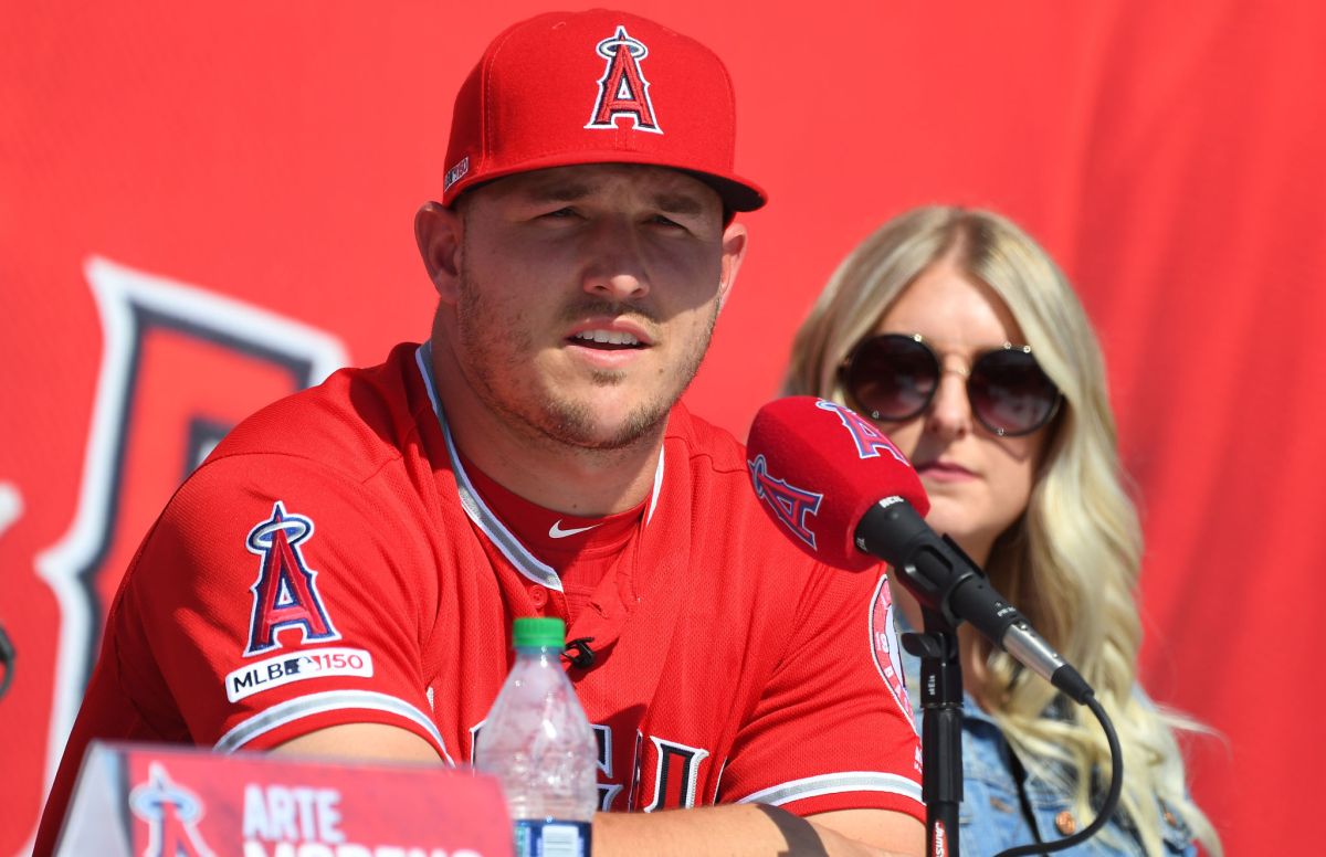 Mike Trout and wife Jessica take part in a news conference.