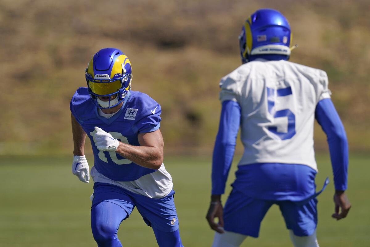 Rams receiver Cooper Kupp, left, runs a pattern under the watch of cornerback Jalen Ramsey during camp Tuesday.