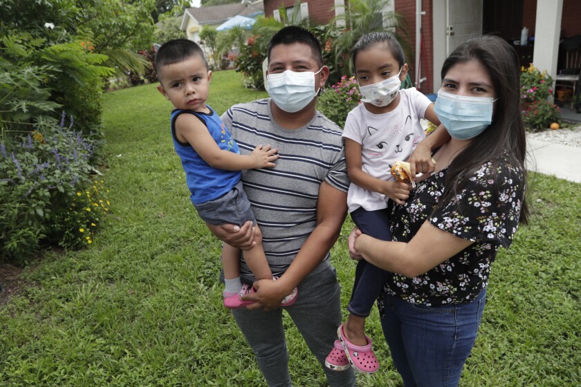 Landscaper Elbin Sales Perez is ill with the coronavirus and isolated at home in Immokalee, Fla., with his family. 