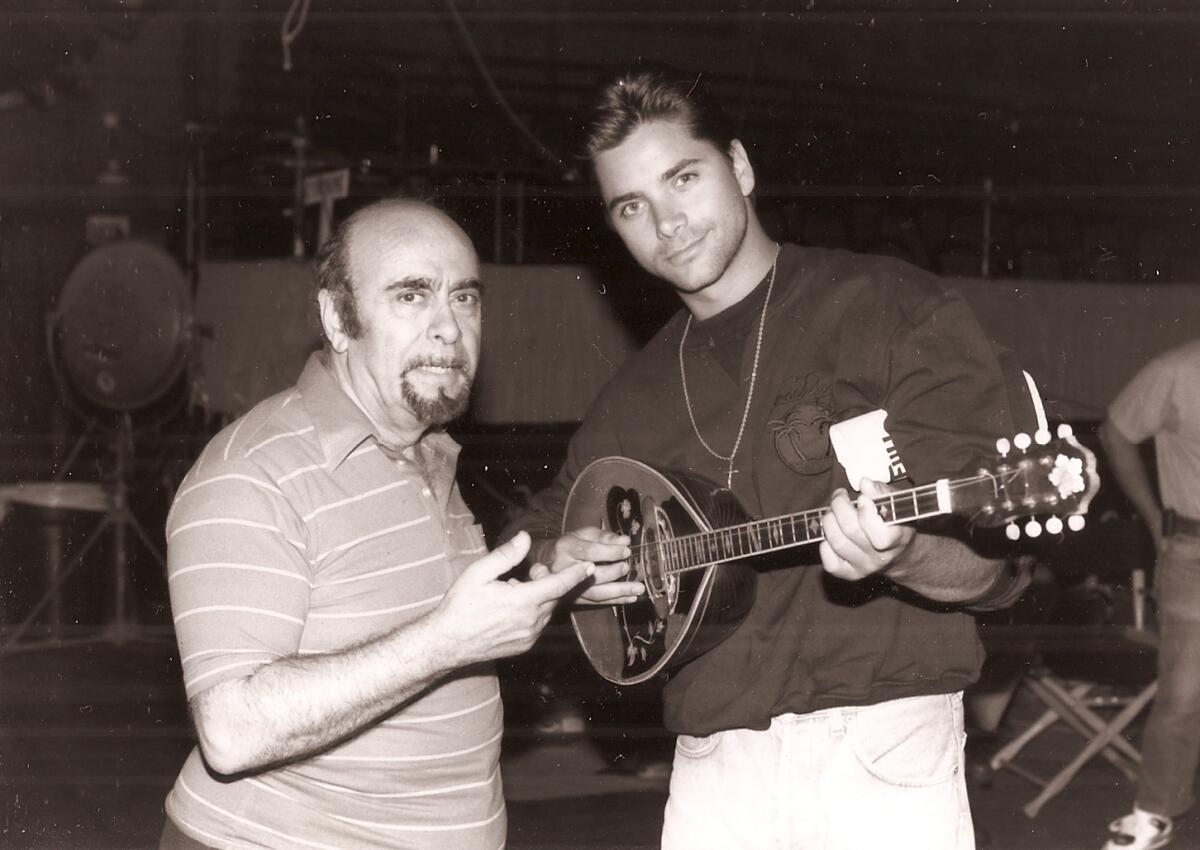 Guy Chookoorian, left, with actor John Stamos on the set of "Full House."