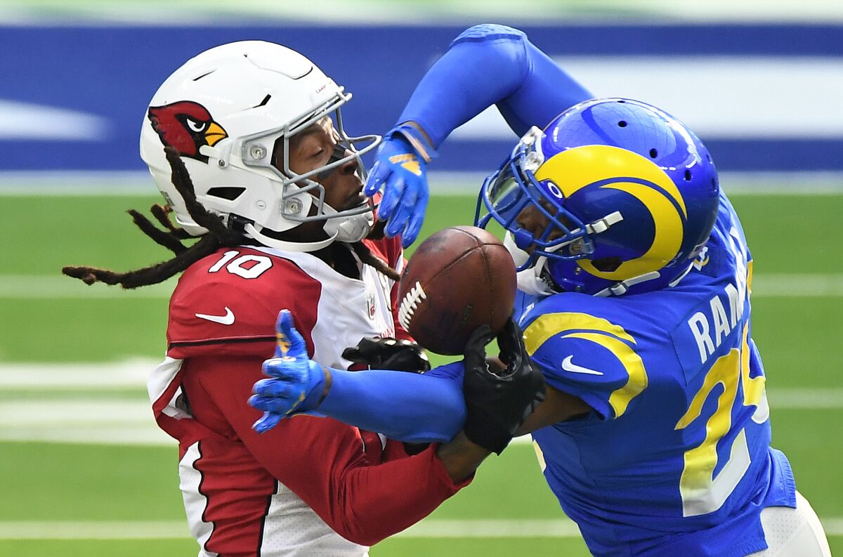 Rams cornerback Jalen Ramsey breaks up a pass intended for Cardinals wide receiver DeAndre Hopkins.