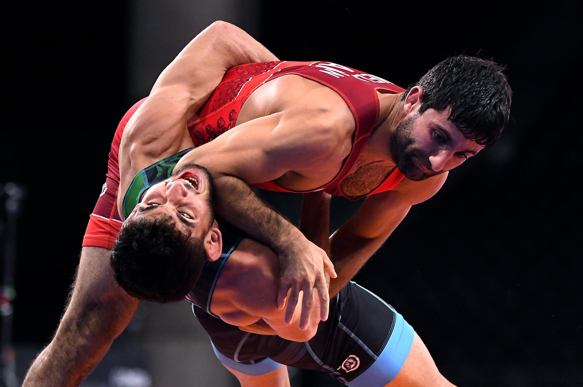 Armenia's Amen Melikyan takes down Iran's Ali Nejati in the 60kg