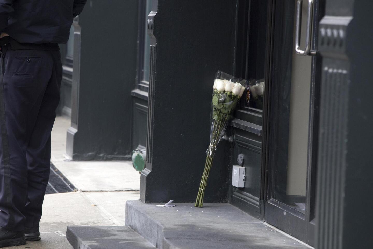 Flowers are placed outside Hoffman's apartment after the actor was found dead
