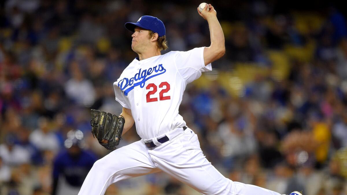 Dodgers starting pitcher Clayton Kershaw earned his 100th win by going 6 2/3 innings on Friday night against the Rockies.
