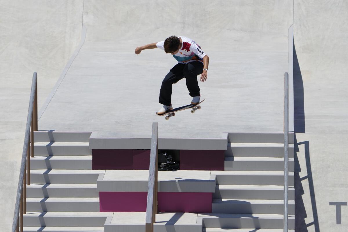An airborne skateboarder