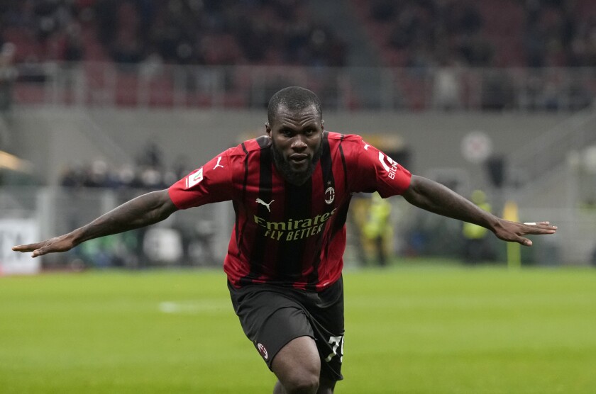 FILE - AC Milan's Franck Kessie celebrates after scoring his side's fourth goal during the Italian Cup quarter final match between AC Milan and Lazio at the San Siro stadium, in Milan, Italy, Wednesday, Feb. 9, 2022. Barcelona has boosted its midfield by signing Franck Kessie as a free agent on Monday, July 4, 2022. (AP Photo/Antonio Calanni, File)