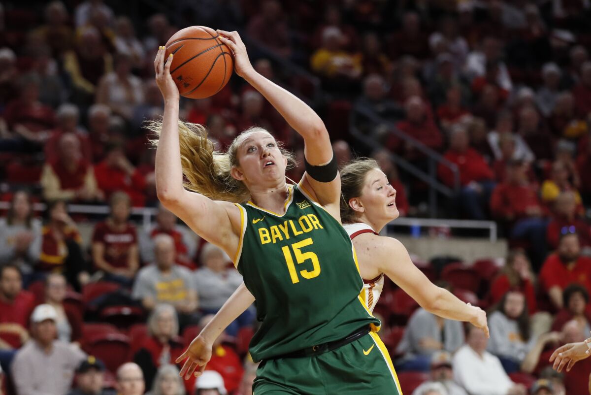 Baylor forward Lauren Cox catches a pass in front of Iowa State guard Ashley Joens during a game in March.