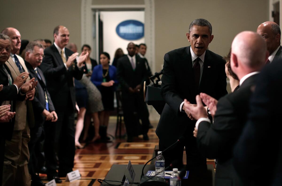 President Obama greets law enforcement leaders after speaking to them in the White House.