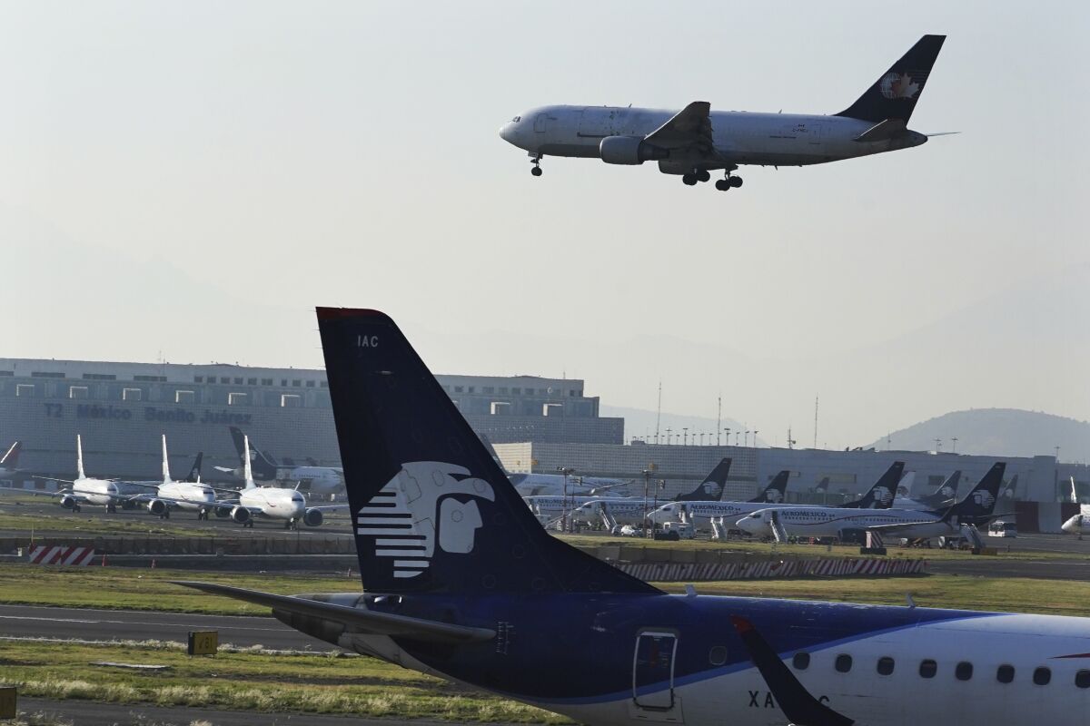 Planes land at Benito Juárez International Airport in Mexico City