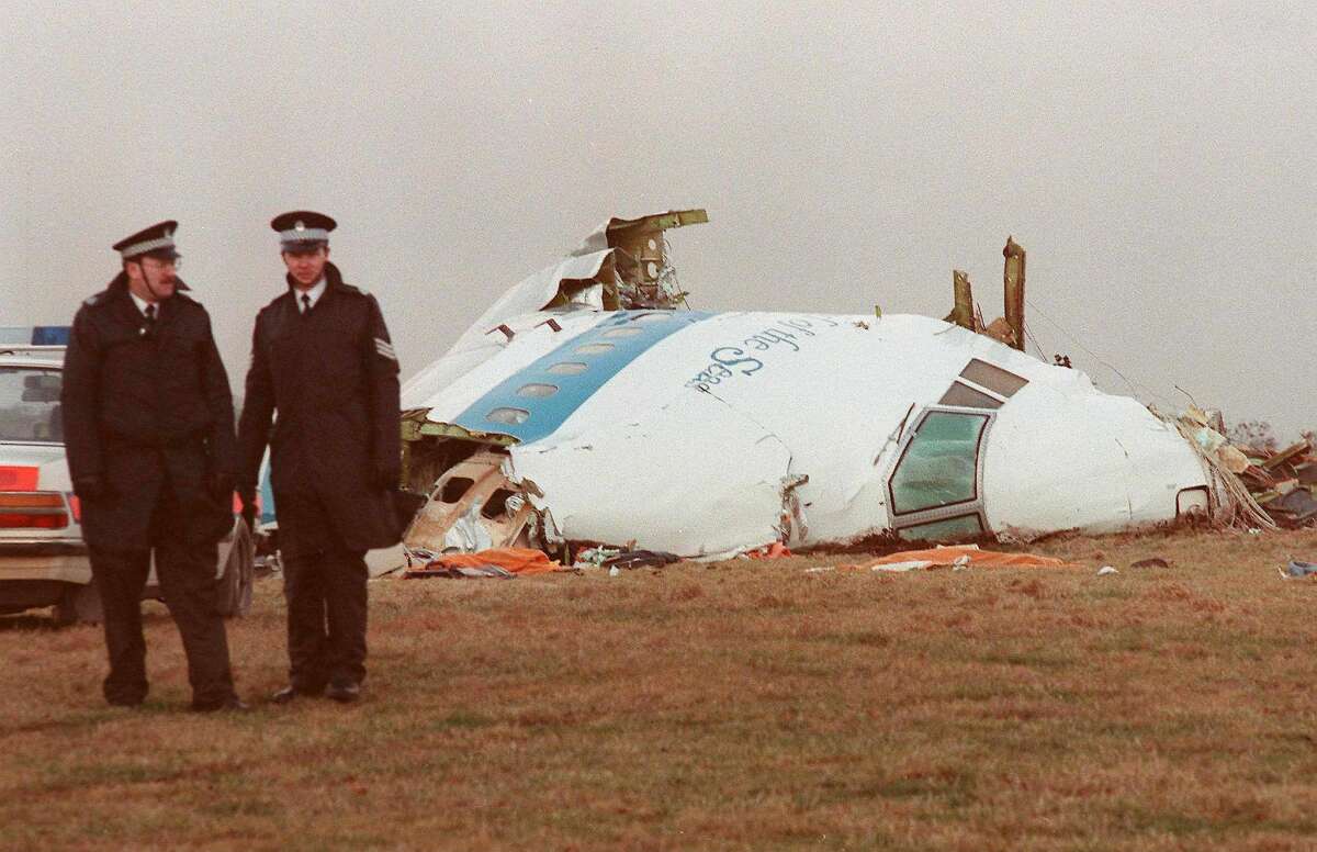 Police officers stand beside the cockpit of the Pan Am Boeing 747 that exploded over Lockerbie, Scotland, on Dec. 21, 1988, killing all 259 people on board and 11 people on the ground.