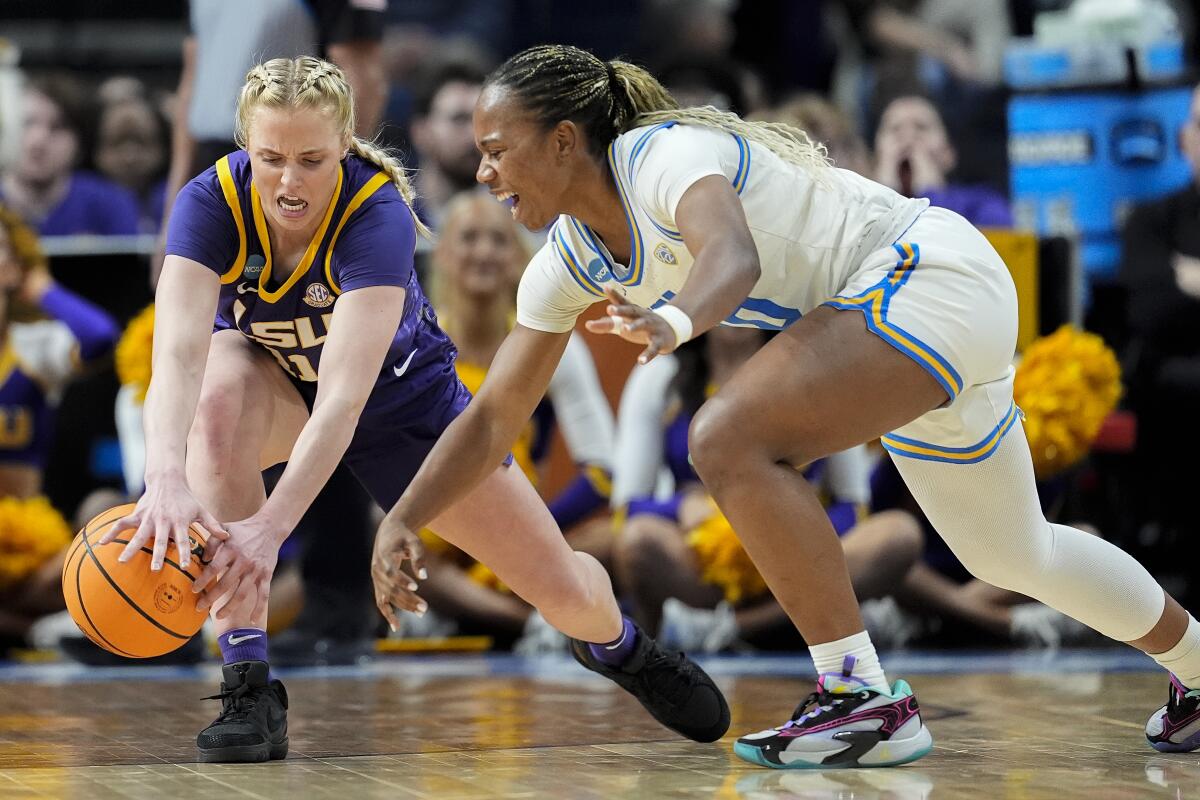 UCLA guard Charisma Osborne, right, tries to steal the ball from LSU guard Hailey Van Lith.