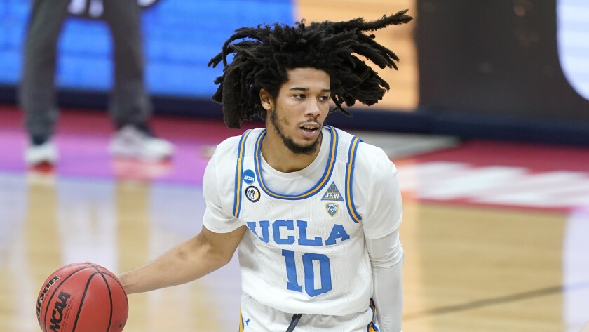 UCLA's Tyger Campbell controls the ball against Abilene Christian on Monday.