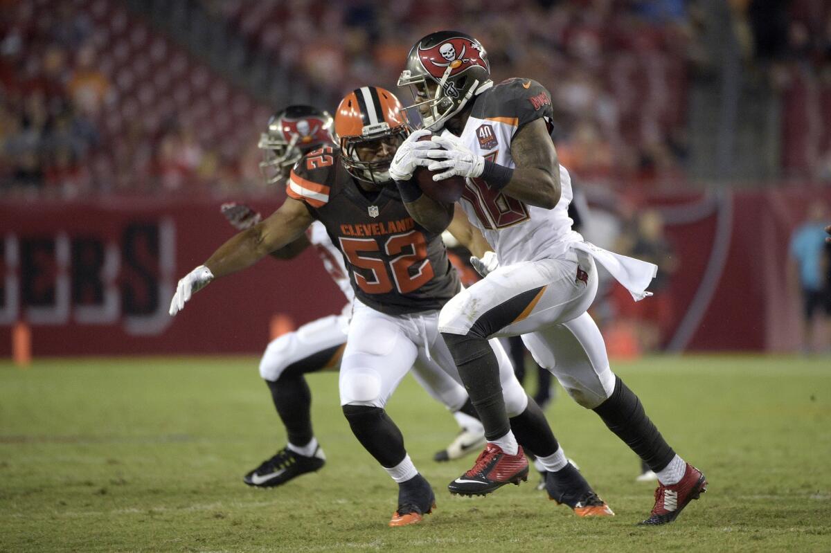 Cleveland's Hayes Pullard looks to tackle Tampa Bay's Rannell Hall during a preseason game in Tampa, Fla., on Aug. 29.