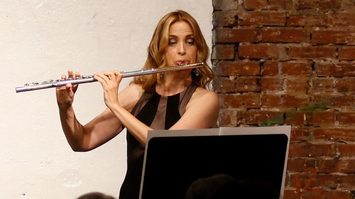 Flutist Sara Andon plays Berio's Sequenza I at Monk Space on Tuesday night.