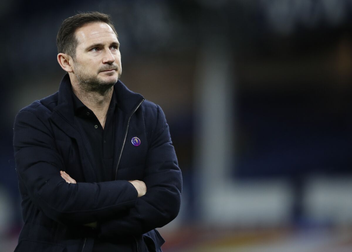 FILE - Chelsea's head coach Frank Lampard looks out during the warm up before the English Premier League soccer match between Everton and Chelsea at Goodison Park in Liverpool, England, Dec. 12, 2020. Frank Lampard will get another shot as a Premier League manager after being hired by Everton, it was announced Monday, Jan. 31, 2022. Lampard replaces Rafa Benitez after his firing two weeks ago. (Clive Brunskill/Pool via AP, File)