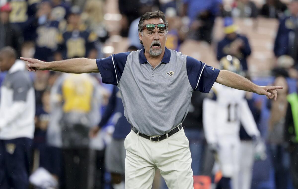 Rams Coach Jeff Fisher watches during warmups before a game against the Miami Dolphins on Nov. 20.