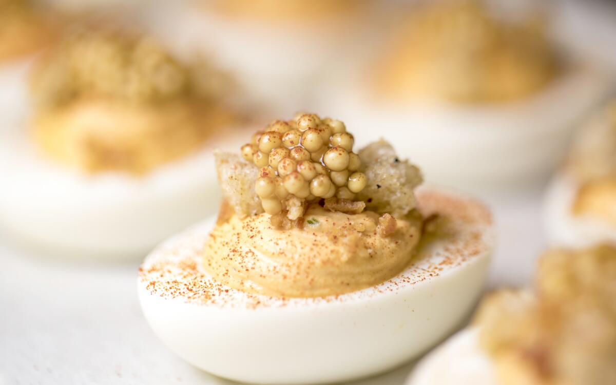 Deviled eggs with croutons and pickled mustard seed