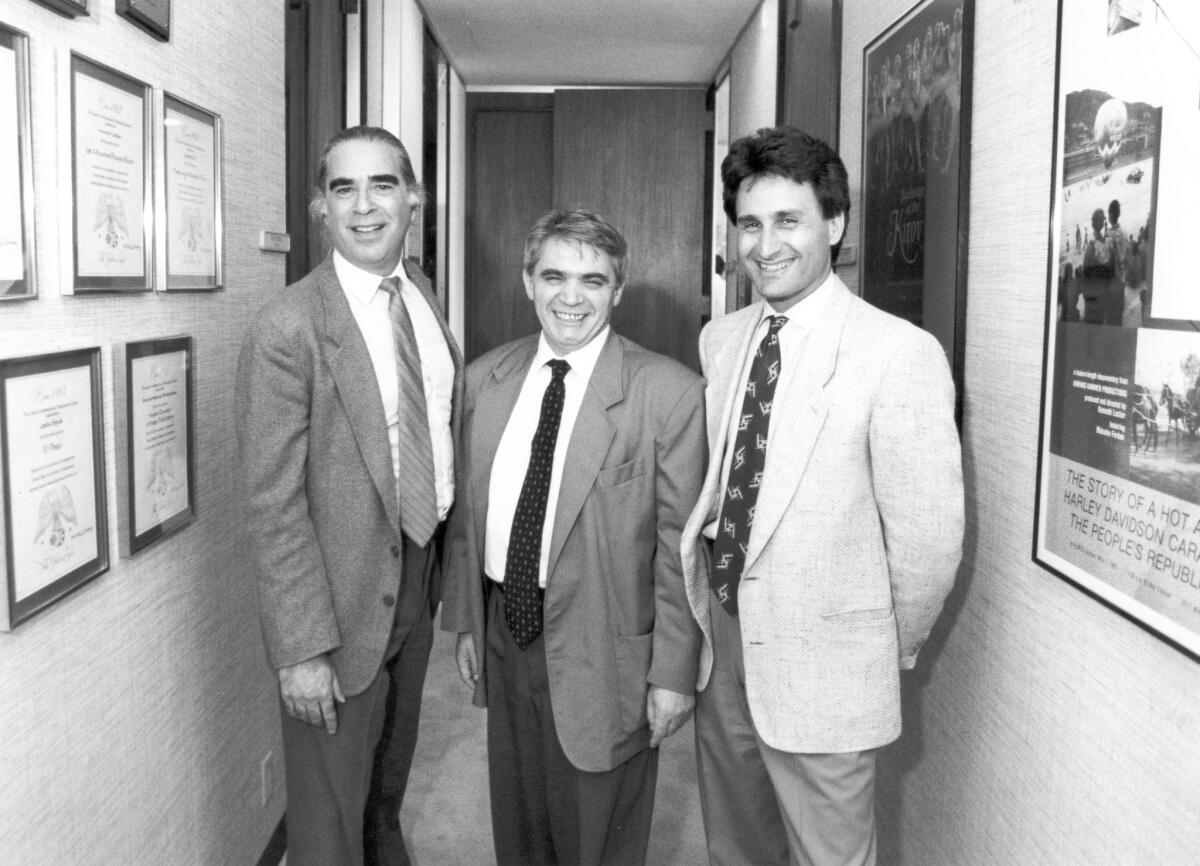 Michael Campus, left, Soviet writer Alexander Gelman and producer Derek Hart in 1990. Campus, director of "The Mack," has died at the age of 80.