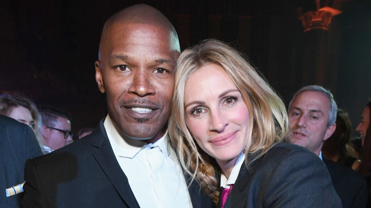 Jamie Foxx and Julia Roberts at the Sean Penn CORE gala at the Wiltern in Los Angeles.