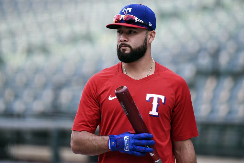 FILE - Texas Rangers' Isiah Kiner-Falefa looks on during batting practice before a baseball game against the Baltimore Orioles, on Sept. 25, 2021, in Baltimore. The Rangers have traded Kiner-Falefa, their starting shortstop last season supplanted by the blockbuster addition of Corey Seager, to the Minnesota Twins for catcher Mitch Garver. (AP Photo/Terrance Williams, File)