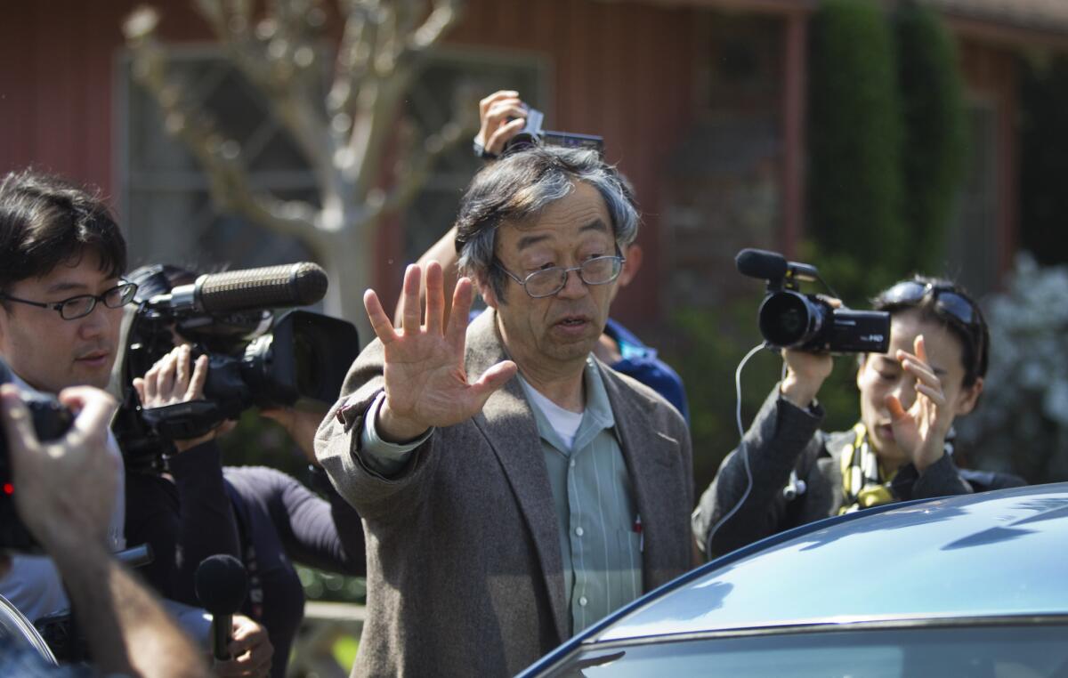 TEMPLE CITY, CA-MARCH 6, 2014: Journalists surround Satoshi Nakamoto, the mythical Bitcoin creator, as he walks to his car from his home in Tempe City Thursday, March 6, 2014. (Photo By Allen J. Schaben / Los Angeles Times)