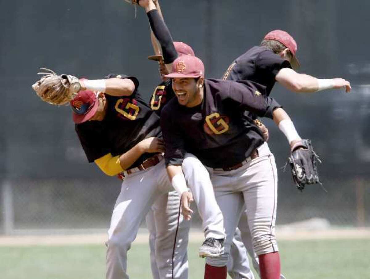 Glendale College players celebrate a win over Grossmont College in the the California Community College Athletic Assn. Baseball Southern Regional Championship at Stengel Field.