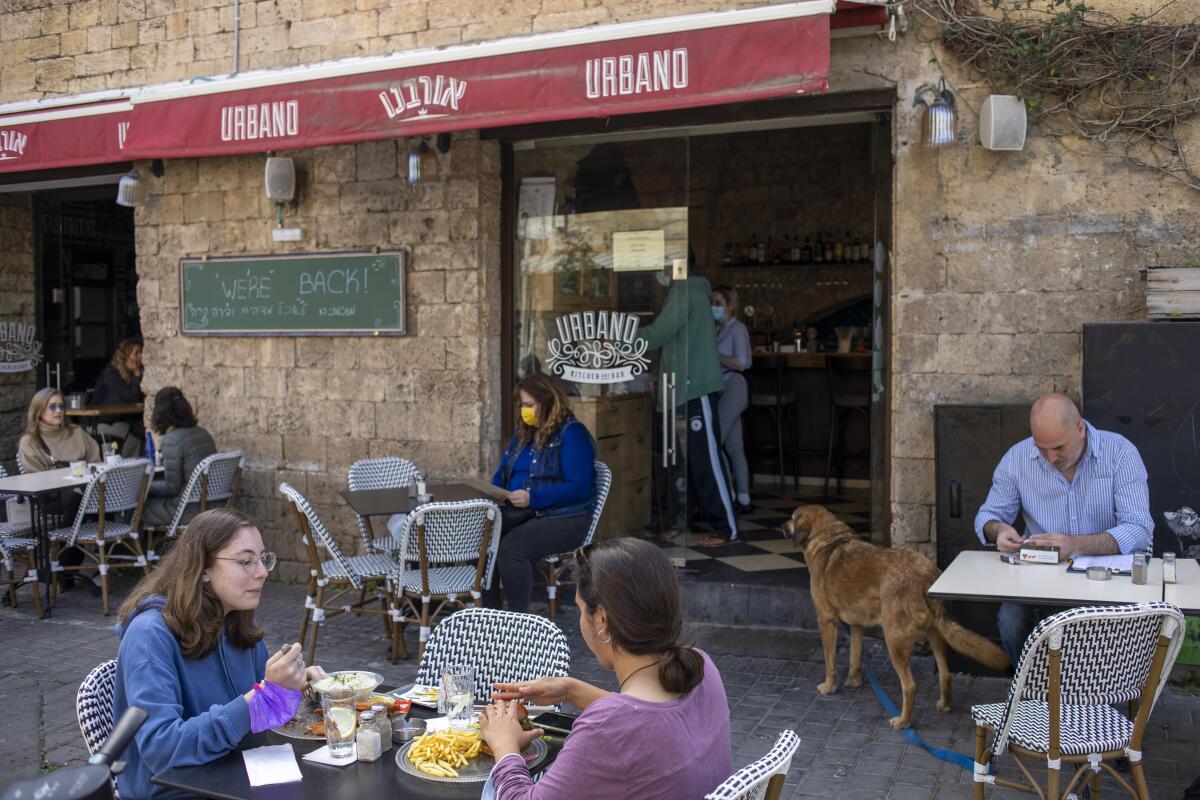 People eat outside at a restaurant